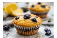 Lemon and blueberry breakfast muffins topped with fresh blueberries