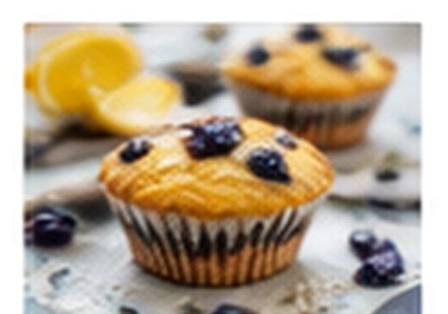Lemon and blueberry breakfast muffins topped with fresh blueberries